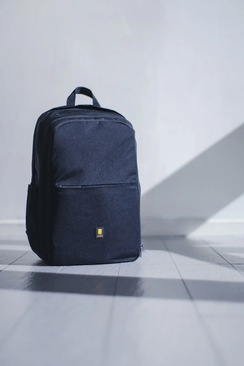 Minimalist travel backpack neatly packed with camera and essentials