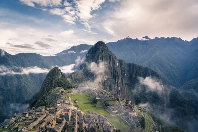 An ancient stone path winding through a misty cloud forest in the Andes mountains near Machu Picchu